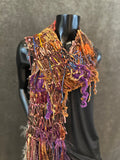 Hand knit Boho style fringed scarf in autumn shades