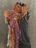 Hand knit Boho style fringed scarf in autumn shades