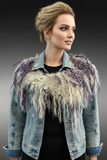 Casual model with distressed jacket wearing luxury fringe cowl