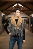 Model with fur collar scarf in rustic vaulted barn