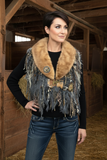 Model with fur collar scarf in vintage horse barn
